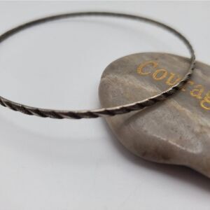Silver toned carved‎ bracelet